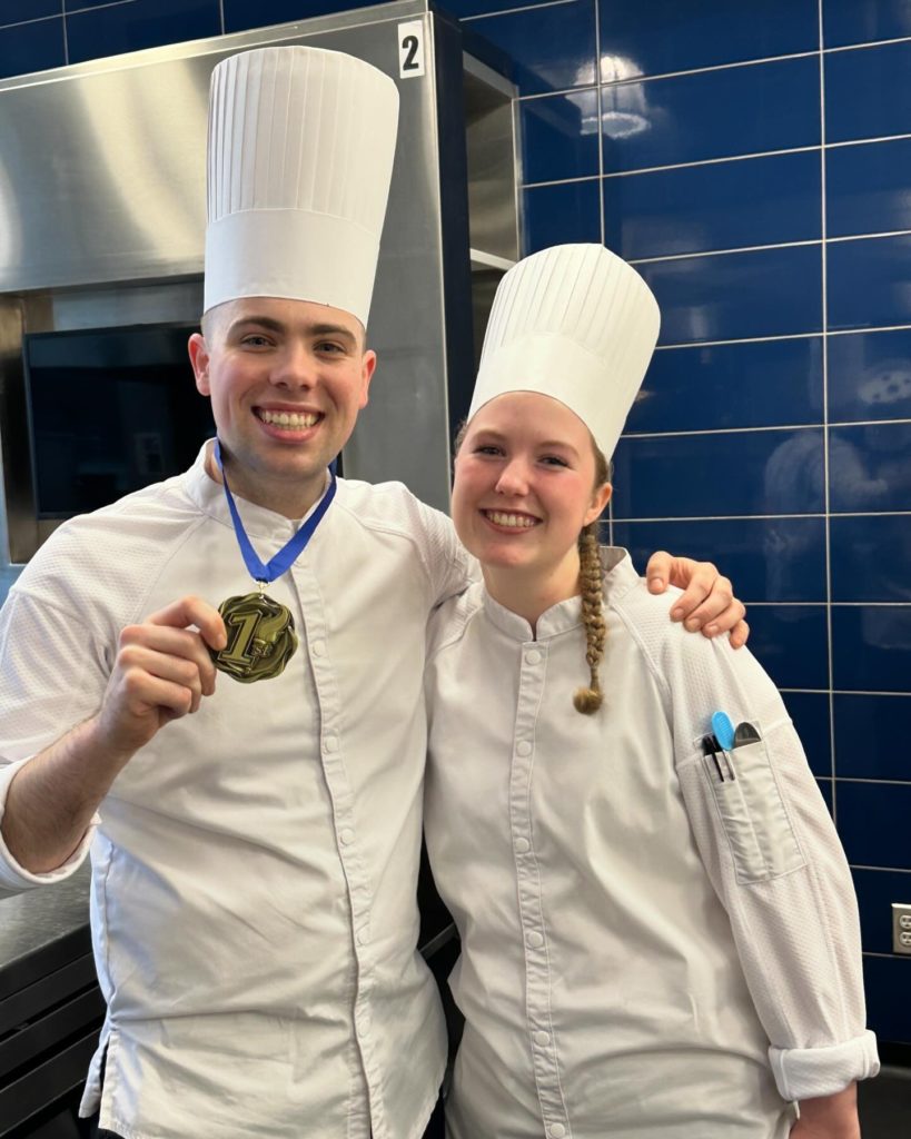 1st place winner Chef Daniel Calabrese with his kitchen assistant, Young Chef Samantha Heino at the 2024 Worldchefs Endorsed Vegan Main Course Competition in Toronto, Canada.